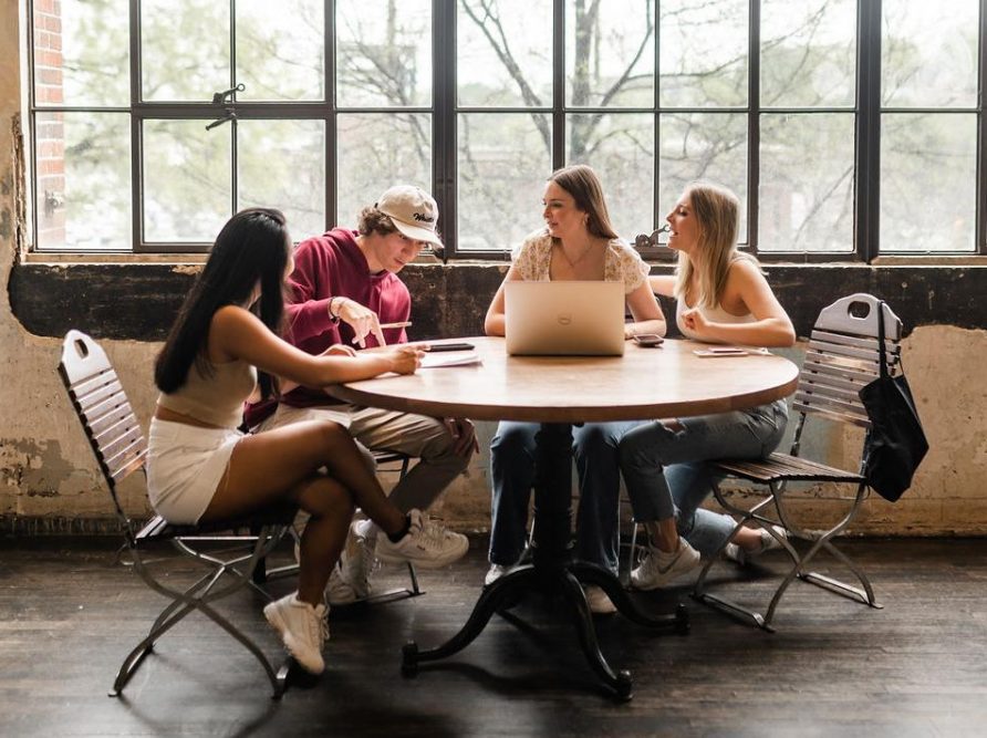 Georgia Tech students sitting at table in Ponce City Market in Midtown Atlanta.