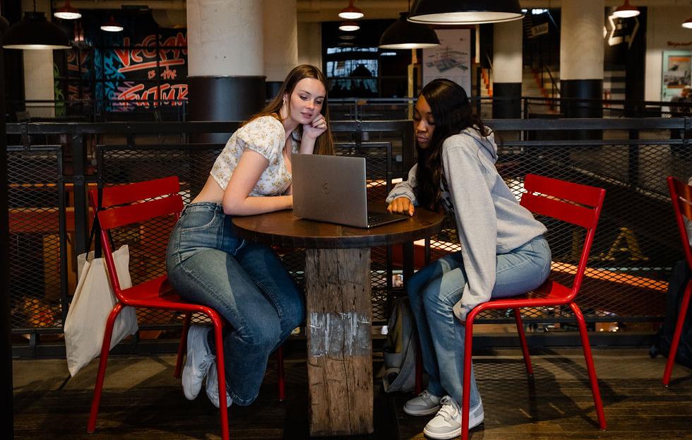 Students searching for housing at a table in Ponce City Market