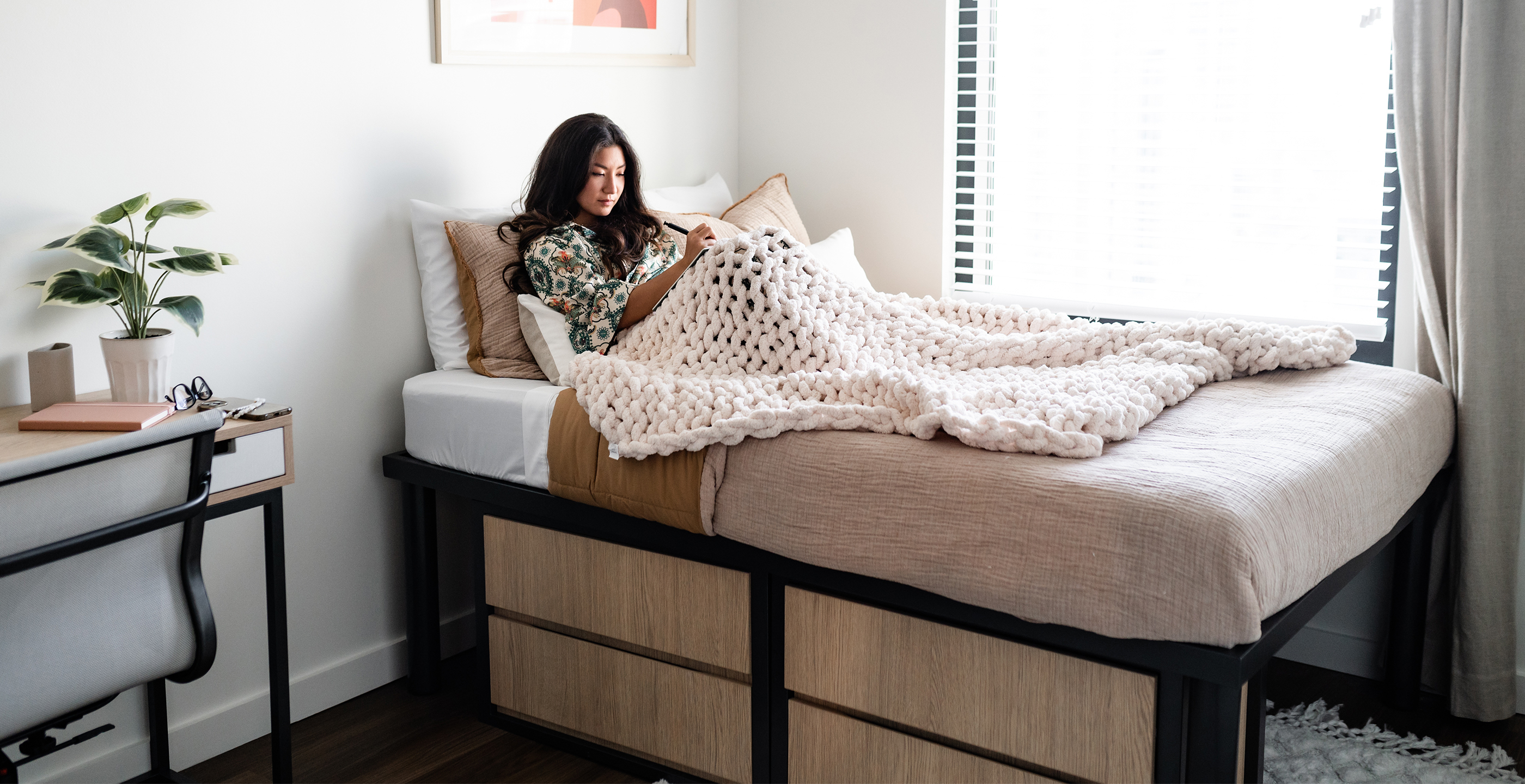 A woman relaxing in her bedroom